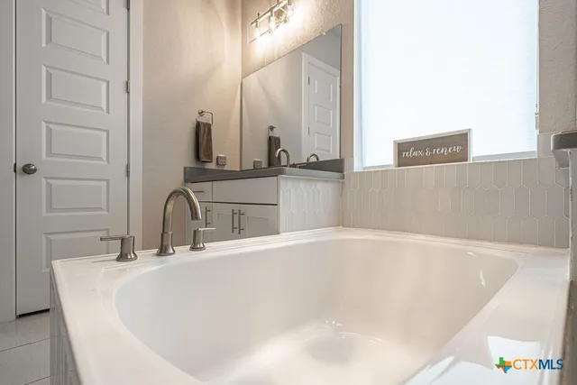 a close view of a sink and a mirror in a bathroom