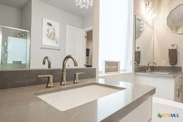 a bathroom with a sink and a bathtub