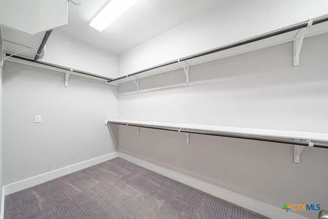 a view of an empty walk in closet