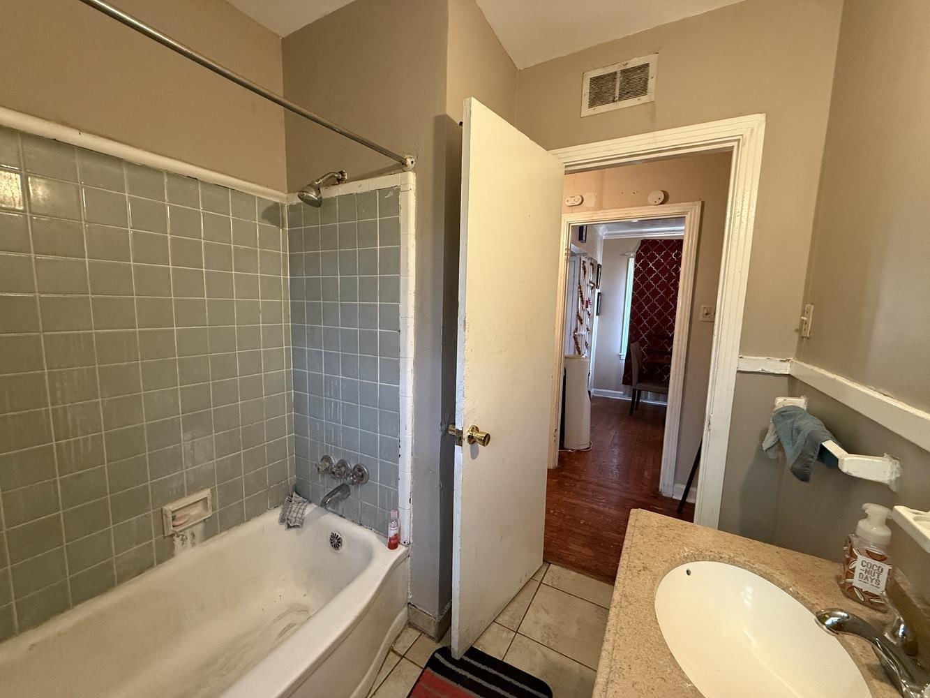 1309 Semmes Street Memphis, TN 38111 - Photo 17 of 24 Bathroom featuring vanity, light tile patterned floors, and tub / shower combination