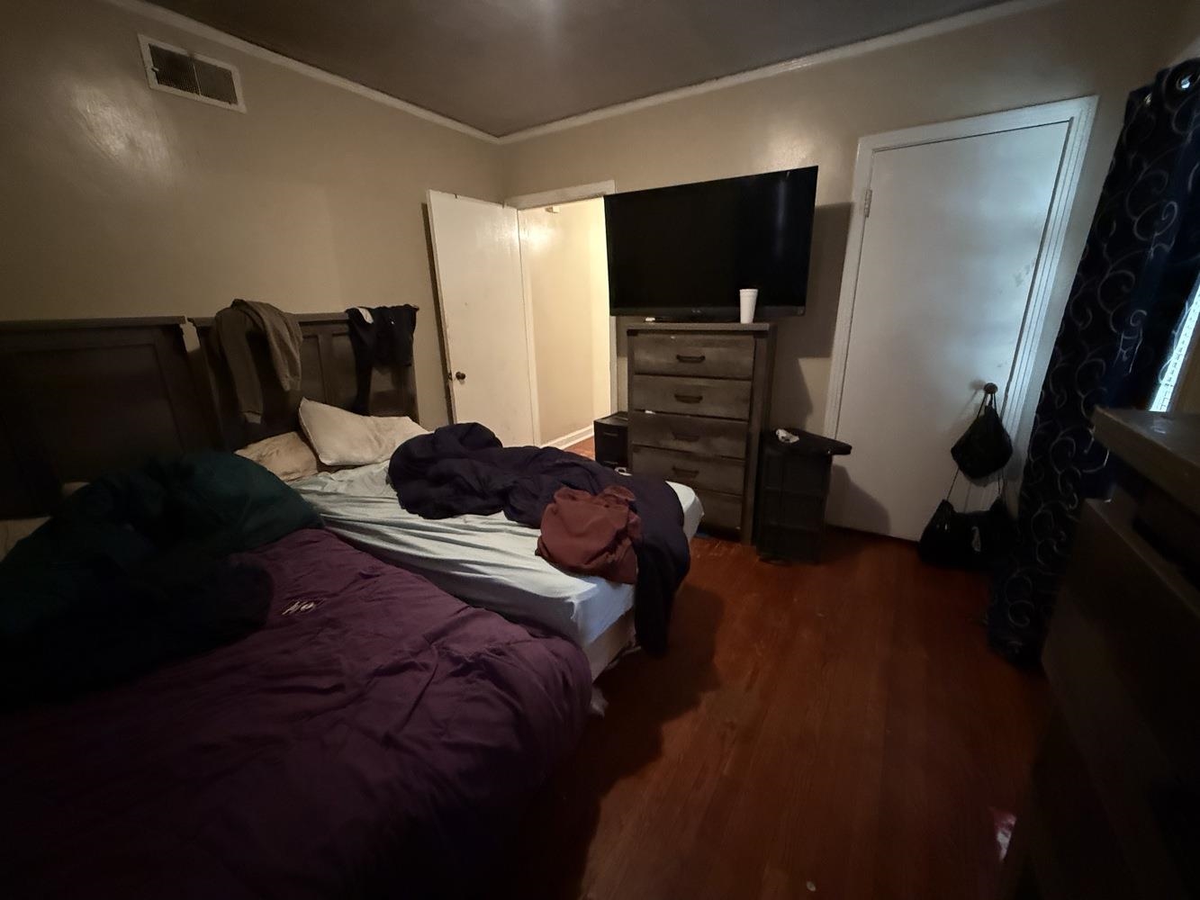 1309 Semmes Street Memphis, TN 38111 - Photo 20 of 24 Bedroom with wood finished floors and crown molding