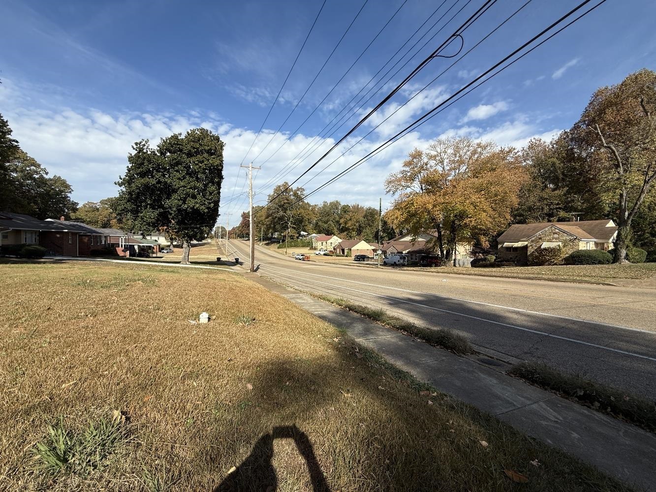 1309 Semmes Street Memphis, TN 38111 - Photo 24 of 24 View of asphalt road featuring sidewalks, a residential view, and view of scattered trees