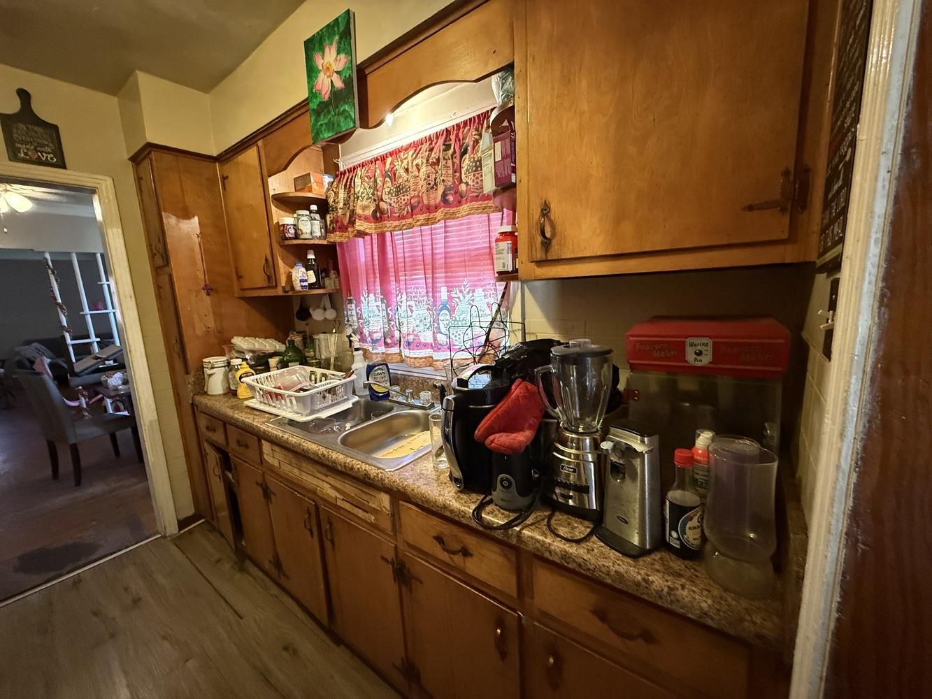 1309 Semmes Street Memphis, TN 38111 - Photo 9 of 24 Kitchen featuring dark wood-type flooring and brown cabinets