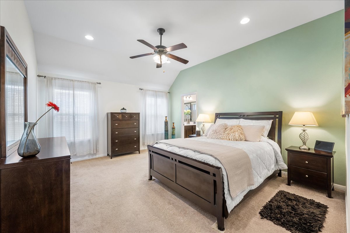 3000 Rio Verde Drive Leander, TX 78641 - Photo 10 of 23 a bedroom with a bed and a chandelier