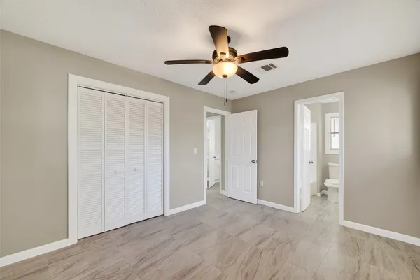 a view of an empty room and wooden floor