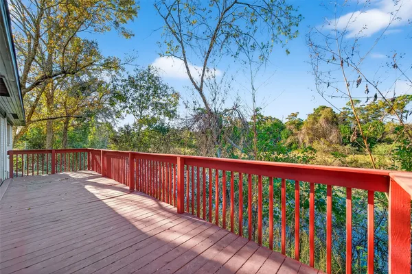 a balcony with wooden floor