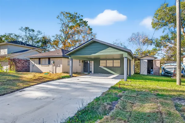 a front view of a house with a yard and porch