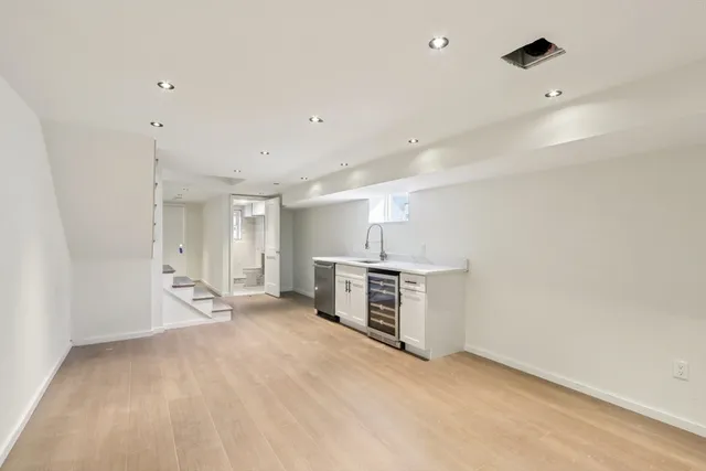 a kitchen with a sink and a stove
