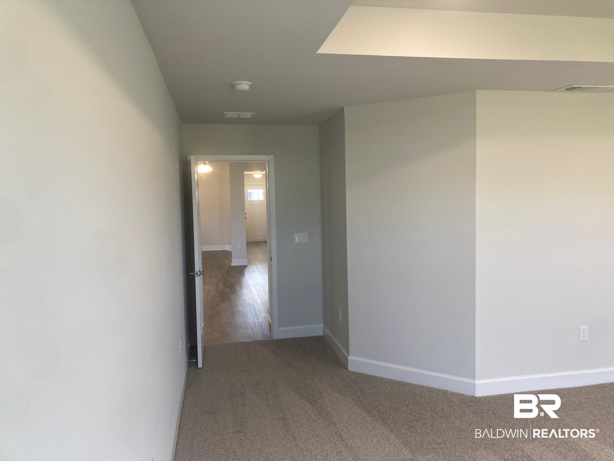 629 Revere Street Foley, AL 36535 - Photo 19 of 30 Corridor with hardwood / wood-style floors