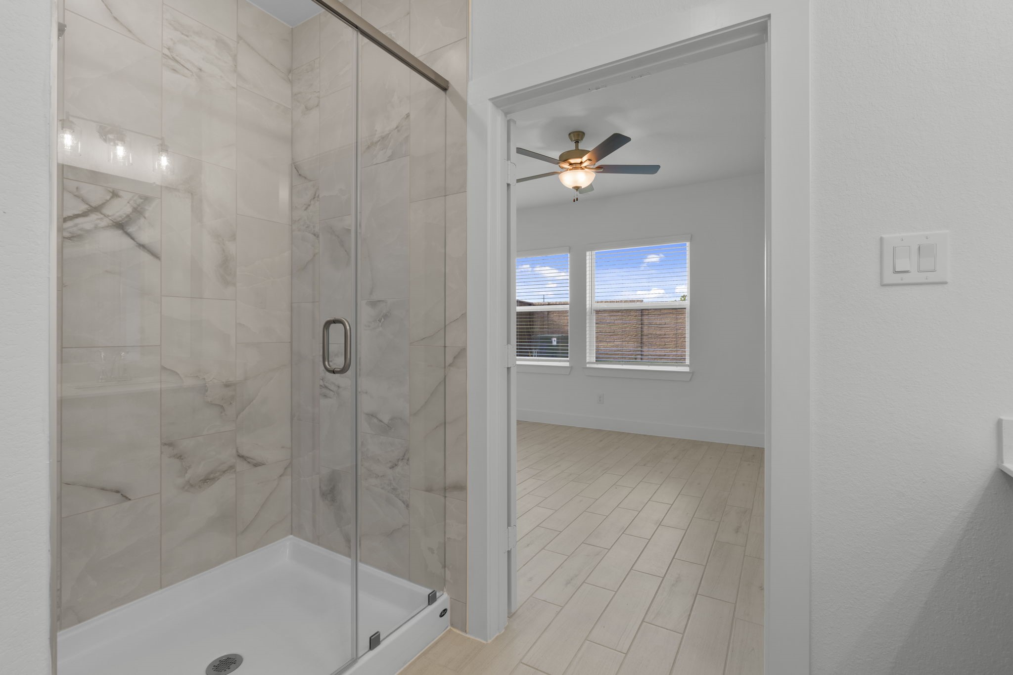 5227 Celestial Court Iowa Colony, TX 77583 - Photo 23 of 43 a bathroom with a light fixture a sink and a mirror