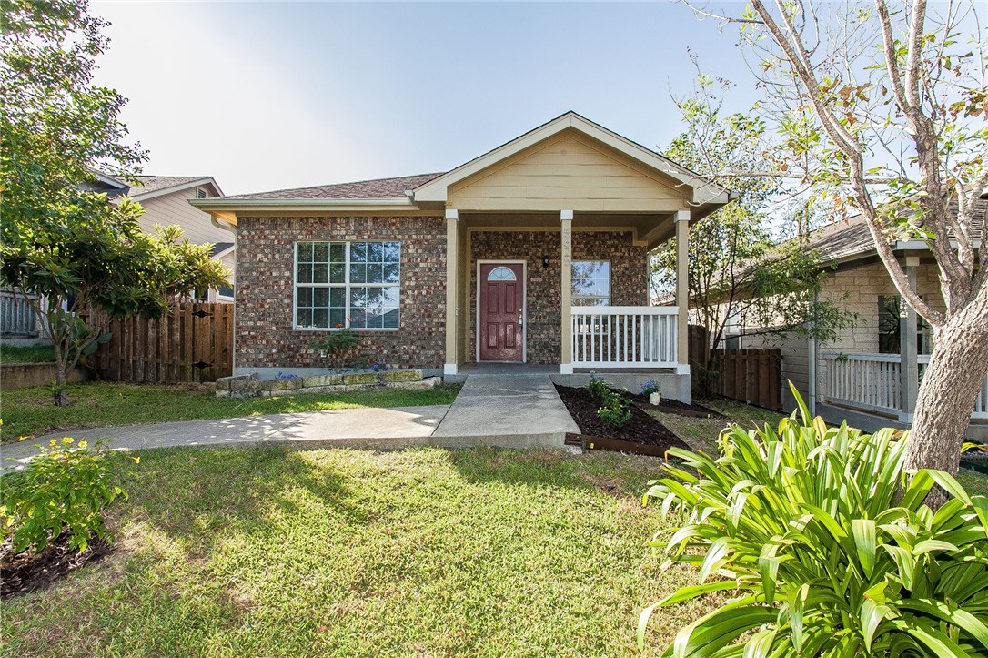 a front view of a house with garden