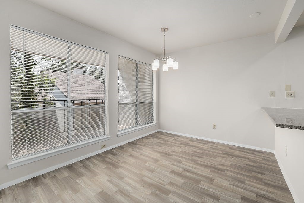 6910 Hart Lane, Unit 907 Austin, TX 78731 - Photo 11 of 28 a view of empty room with wooden floor and fan