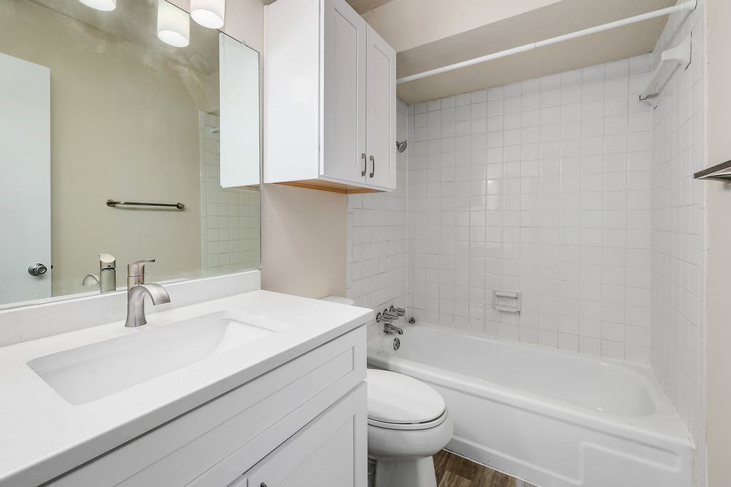 6910 Hart Lane, Unit 907 Austin, TX 78731 - Photo 19 of 28 a bathroom with a sink toilet and shower