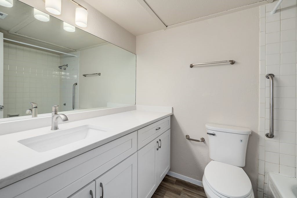 6910 Hart Lane, Unit 907 Austin, TX 78731 - Photo 23 of 28 a bathroom with a sink toilet and shower