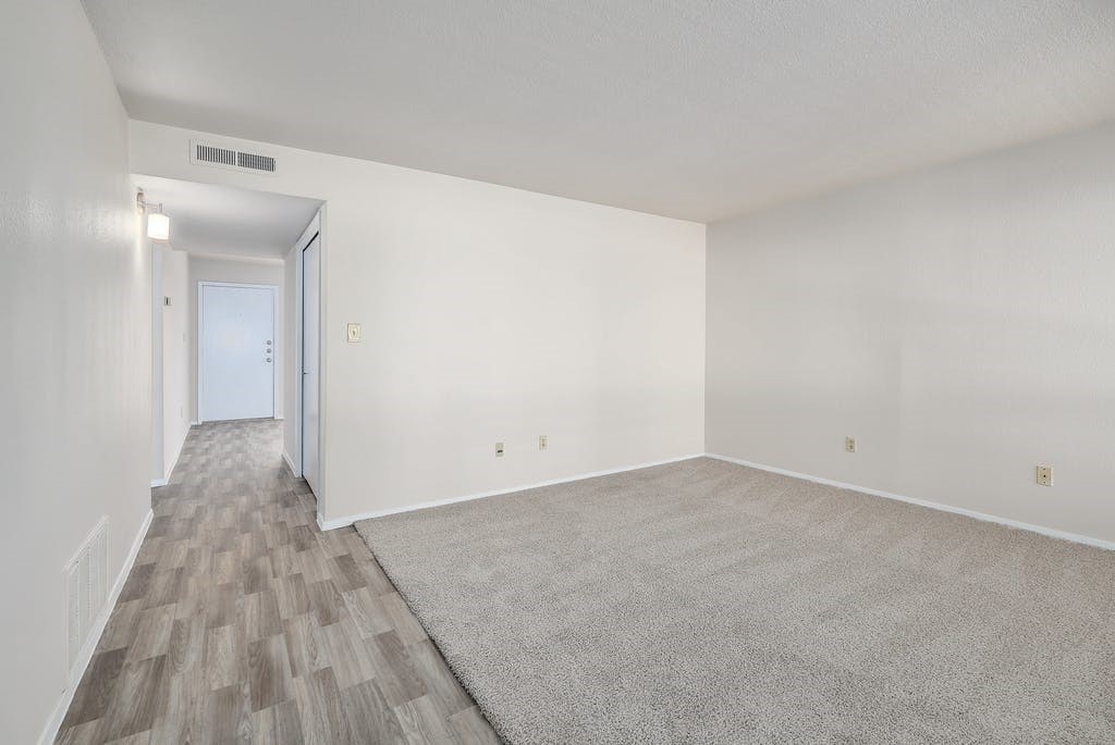 6910 Hart Lane, Unit 907 Austin, TX 78731 - Photo 8 of 28 a view of an empty room and wooden floor