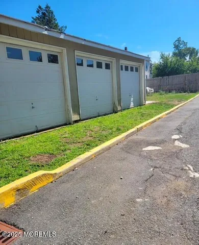 a view of a house with a yard and garage