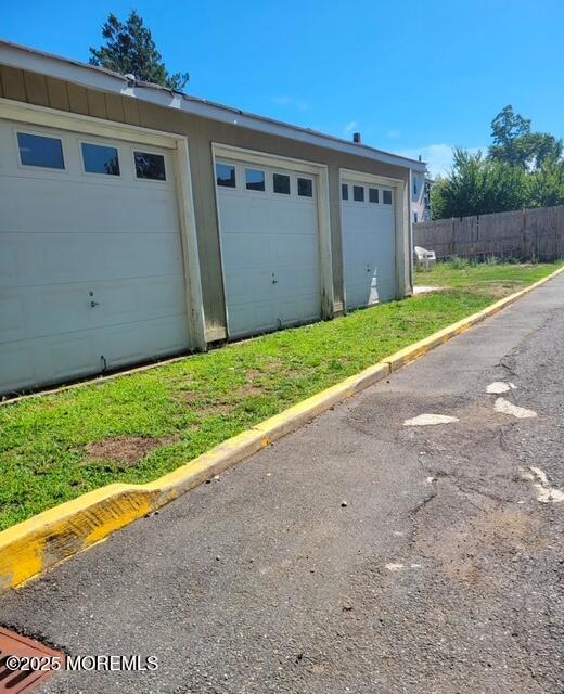 30 Institute Street Freehold, NJ 07728 - Photo 6 of 8 a view of a house with a yard and garage