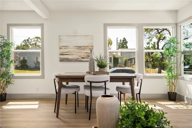 a living room with a couch and a floor to ceiling window