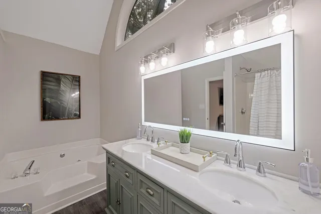 a bathroom with a bathtub and a shower
