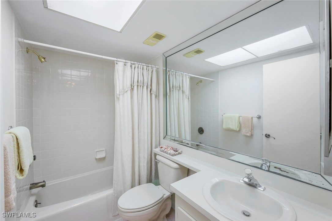 15010 Punta Rassa Road, Unit 108 Fort Myers, FL 33908 - Photo 19 of 30 a bathroom with a sink a toilet and shower