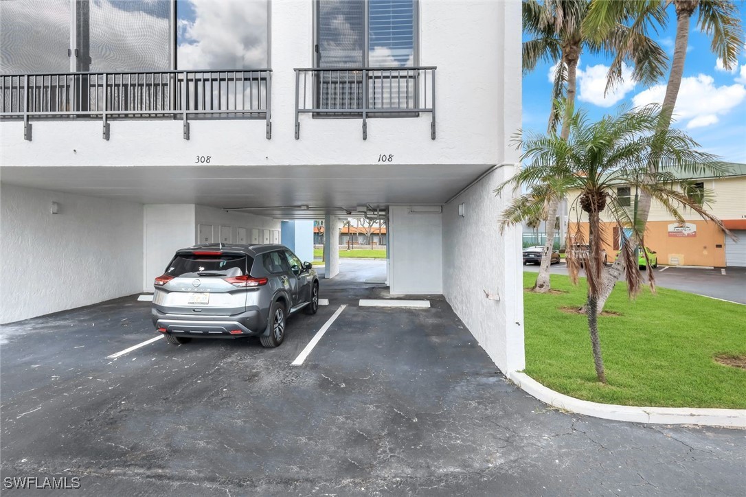 15010 Punta Rassa Road, Unit 108 Fort Myers, FL 33908 - Photo 24 of 30 a view of parking area