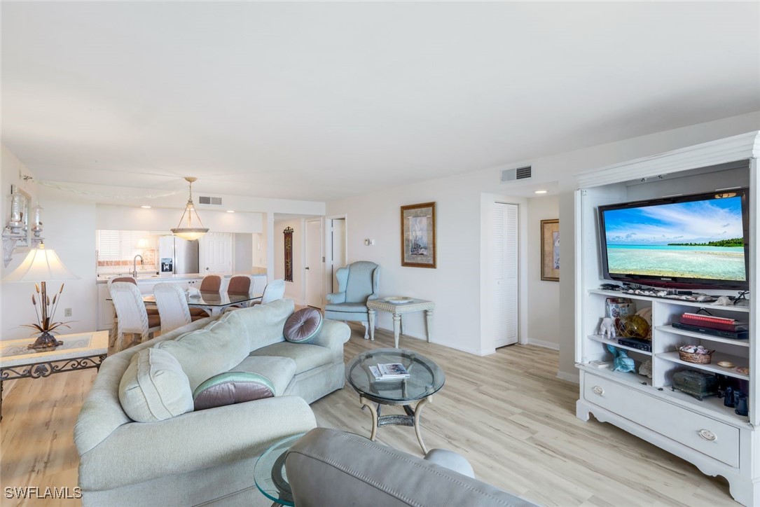 15010 Punta Rassa Road, Unit 108 Fort Myers, FL 33908 - Photo 7 of 30 a living room with furniture and a flat screen tv