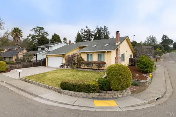 a view of a house with swimming pool and a yard