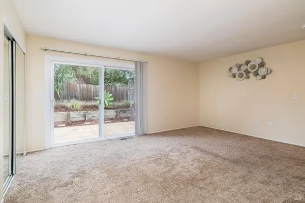 an empty room with large window