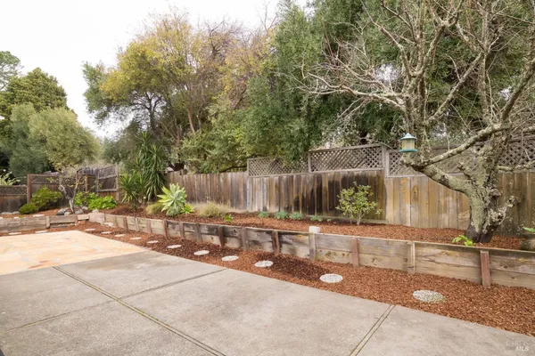 a view of a bench in a backyard