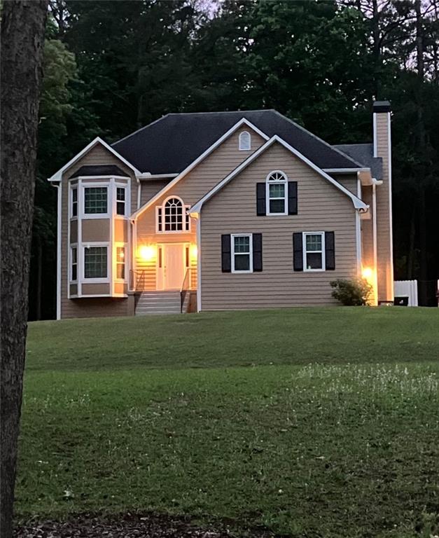 405 Ridgemont Drive Fayetteville, GA 30215 - Photo 1 of 43 a front view of a house with a yard
