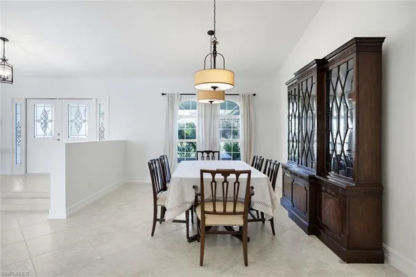 a very nice looking dining room with a table and chairs