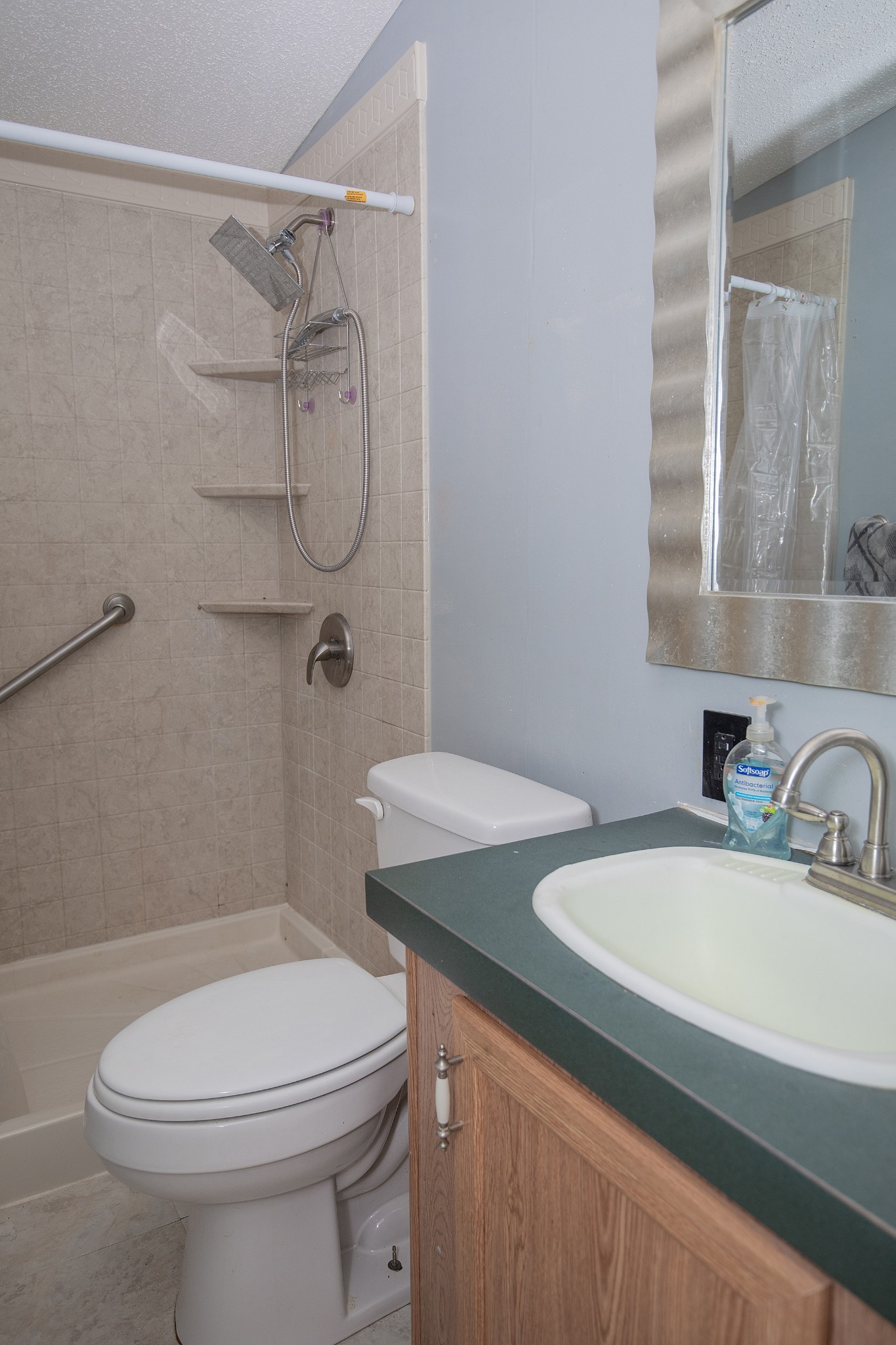 2113 Sugar Camp Road Springfield, TN 37172 - Photo 30 of 47 a bathroom with a sink a toilet and shower
