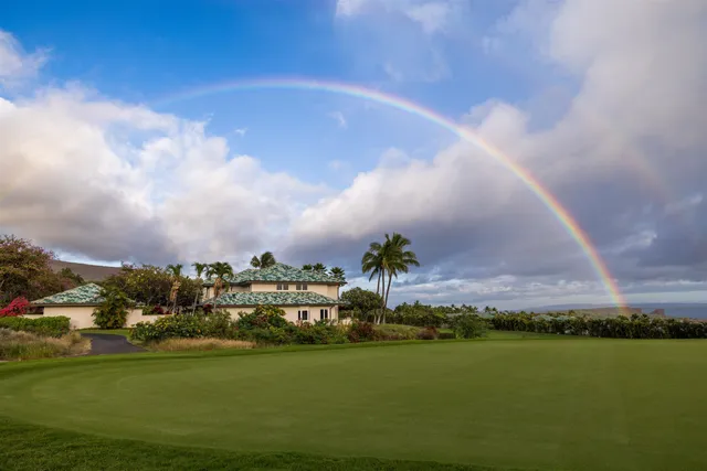 a view of a lake with houses in the back
