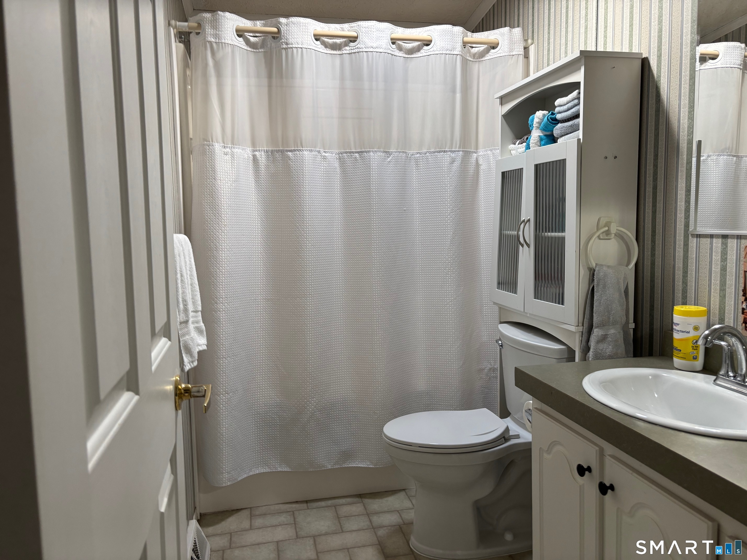 25 Kitty Lane Windham, CT 06256 - Photo 11 of 39 a bathroom with a sink a toilet and shower