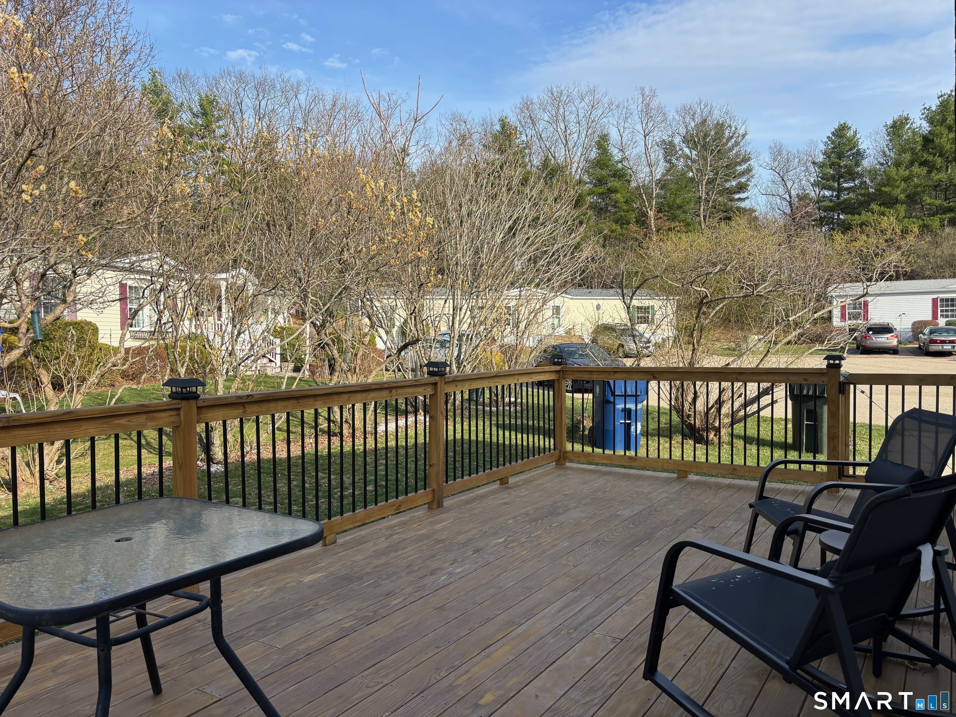 25 Kitty Lane Windham, CT 06256 - Photo 18 of 39 a view of a balcony with wooden floor and outdoor seating