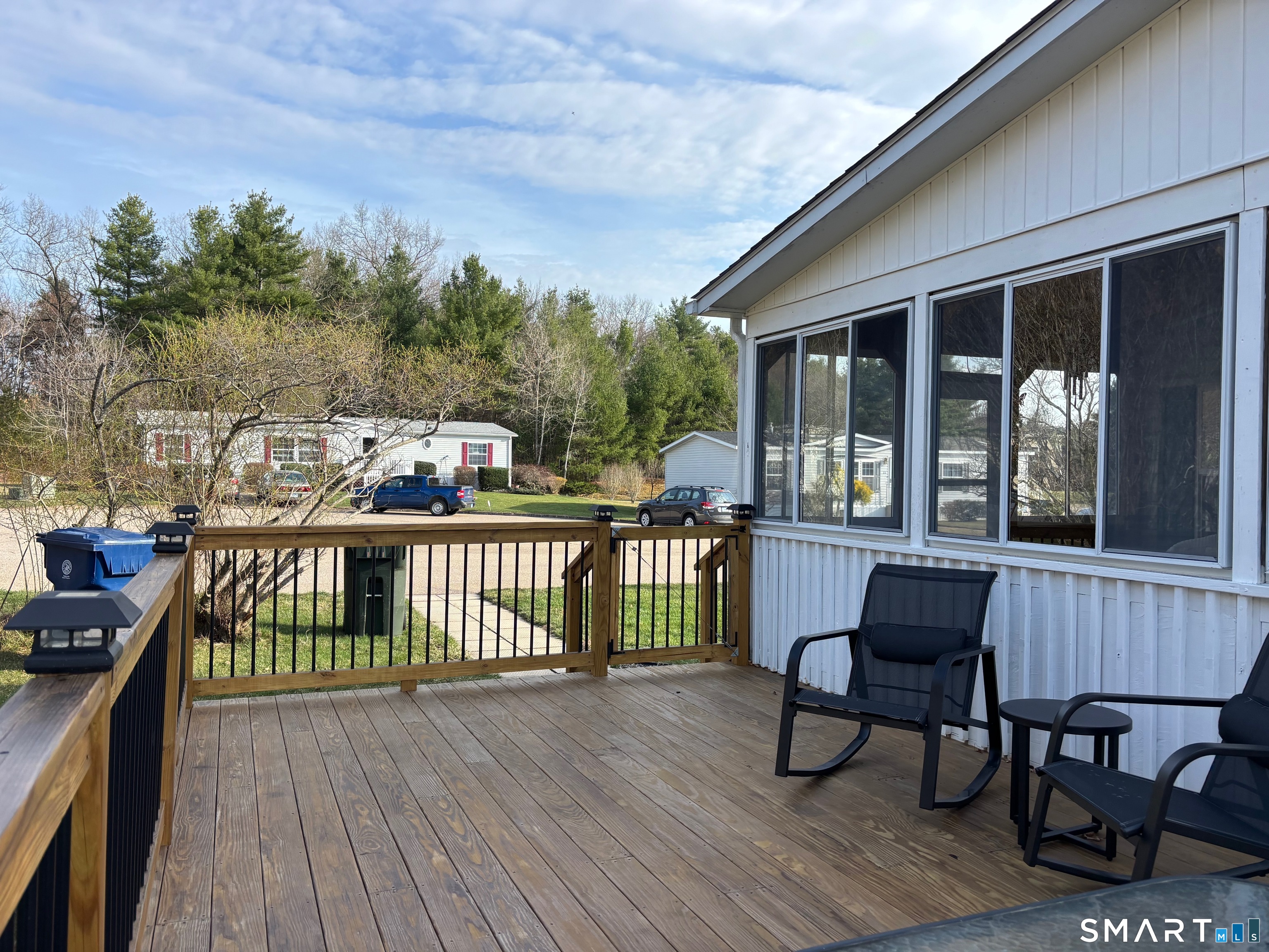 25 Kitty Lane Windham, CT 06256 - Photo 19 of 39 a view of a two chairs and table in the balcony