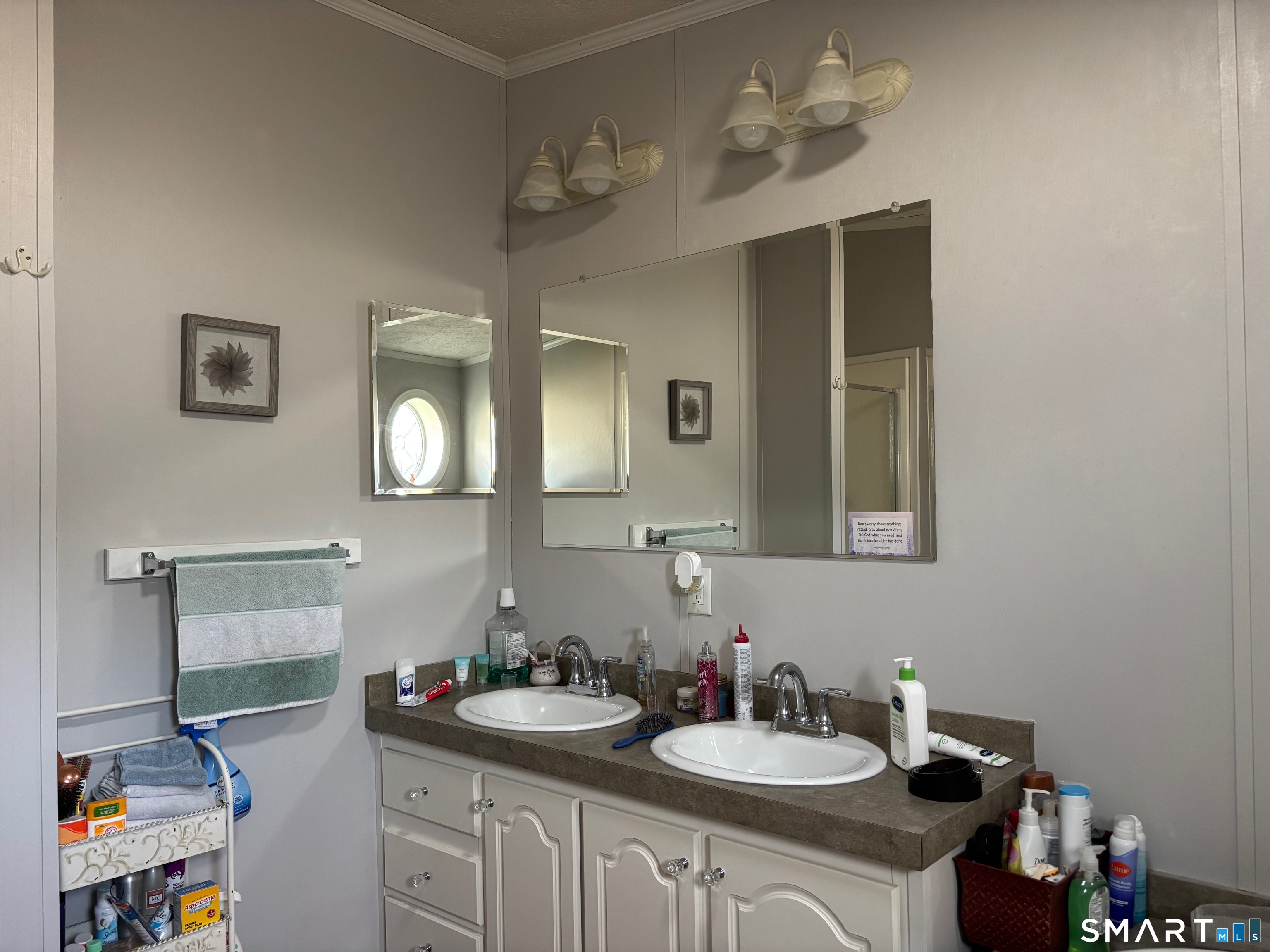 25 Kitty Lane Windham, CT 06256 - Photo 23 of 39 a bathroom with a sink vanity and mirror