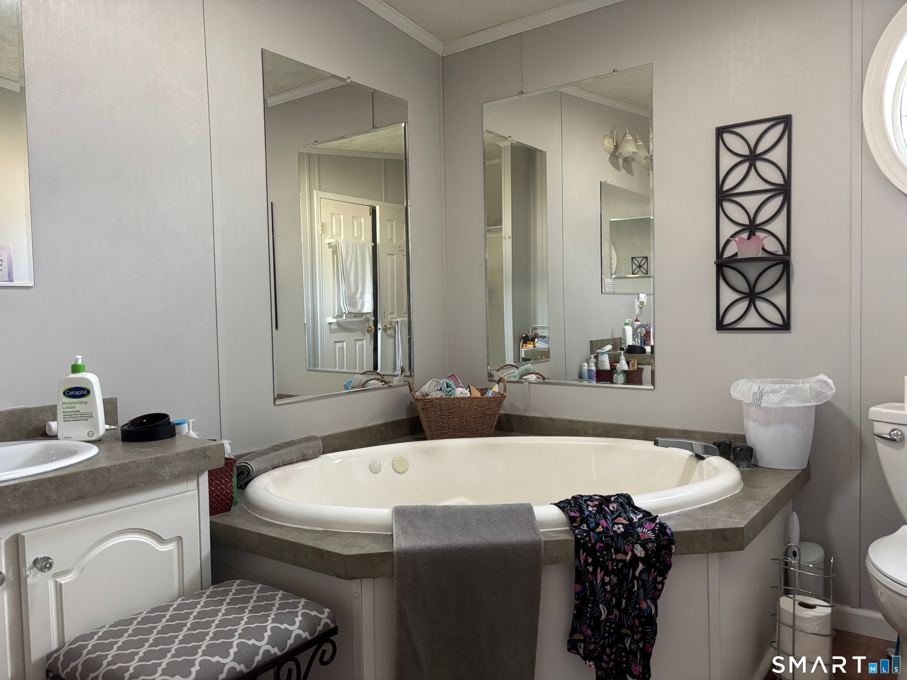 25 Kitty Lane Windham, CT 06256 - Photo 24 of 39 a bathroom with a sink and a mirror