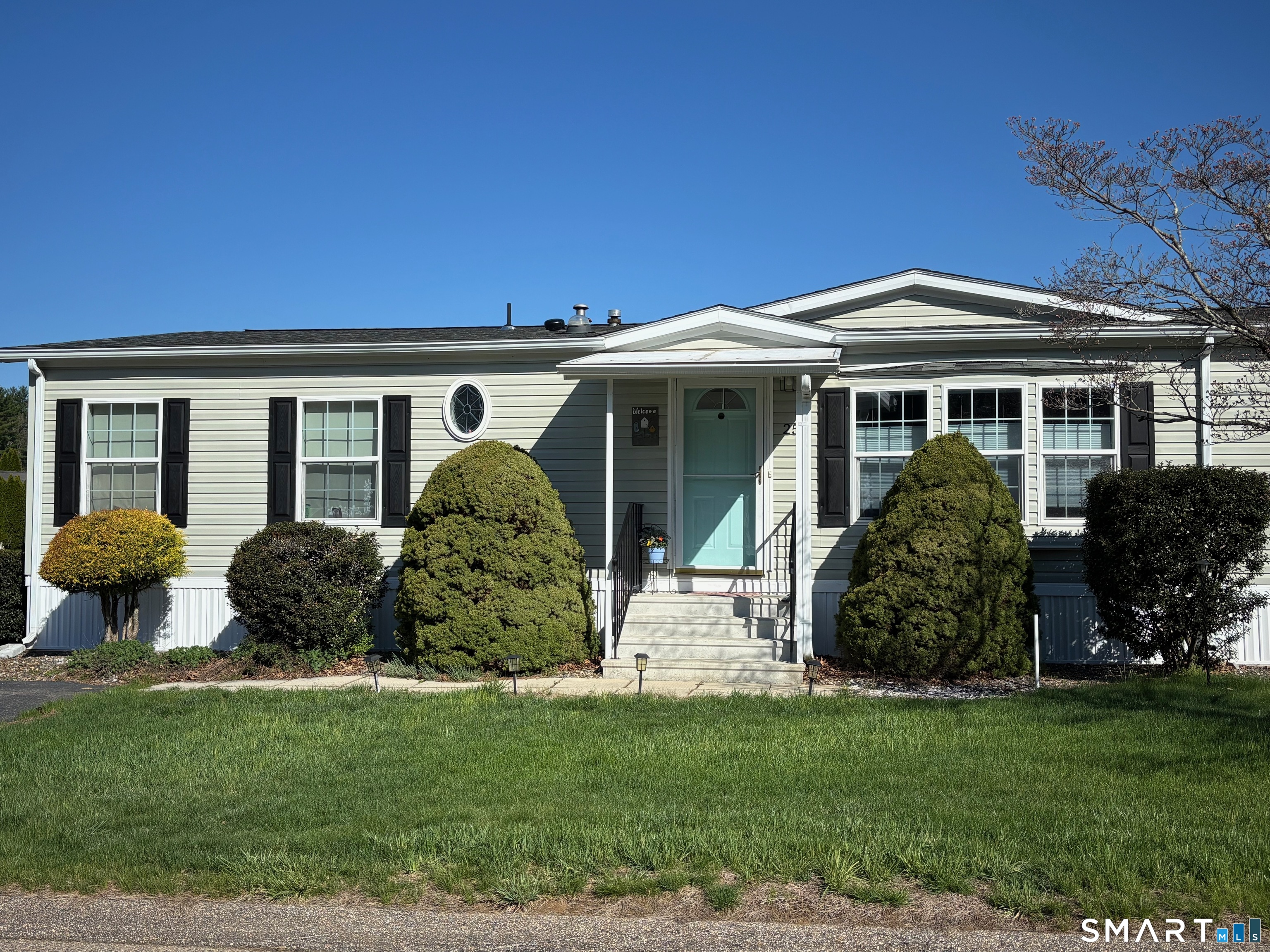 25 Kitty Lane Windham, CT 06256 - Photo 27 of 39 a front view of a house with a garden