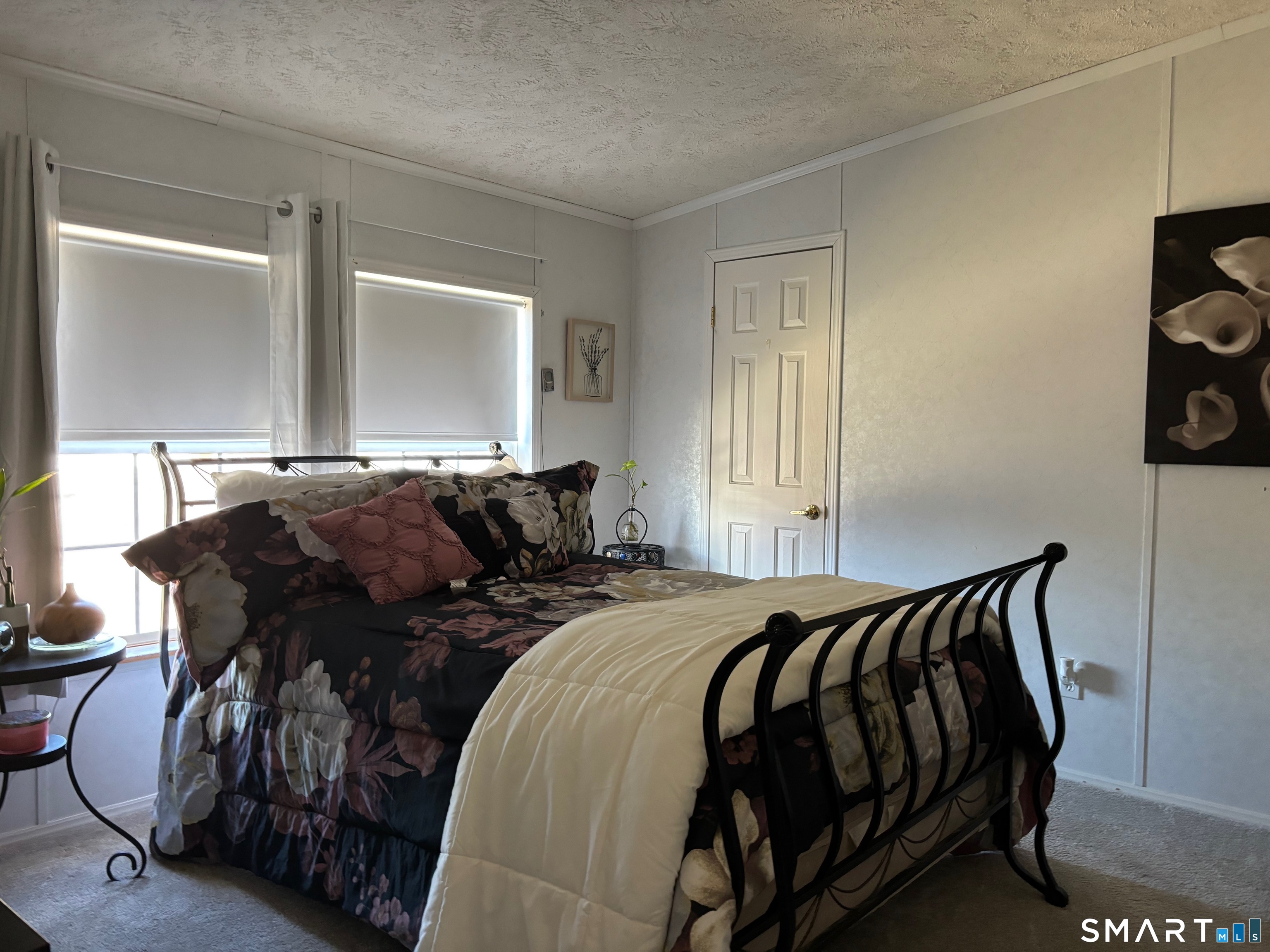 25 Kitty Lane Windham, CT 06256 - Photo 10 of 39 a bed sitting in a bedroom next to a window