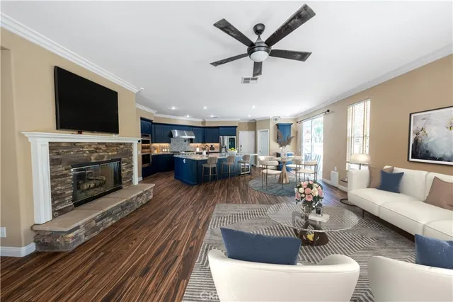 a large kitchen with granite countertop a lot of counter space and wooden floor
