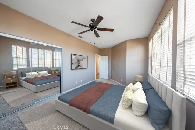 a large kitchen with stainless steel appliances granite countertop a stove a refrigerator a sink and a oven with wooden floor