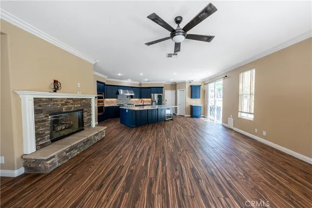 a view of a room with wooden floor and exposed radiator