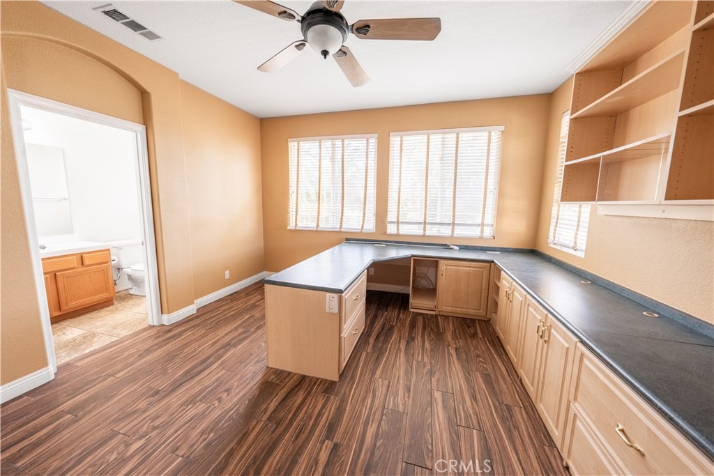 31465 Inverness Court Temecula, CA 92591 - Photo 22 of 71 a view of a room with wooden floor and exposed radiator