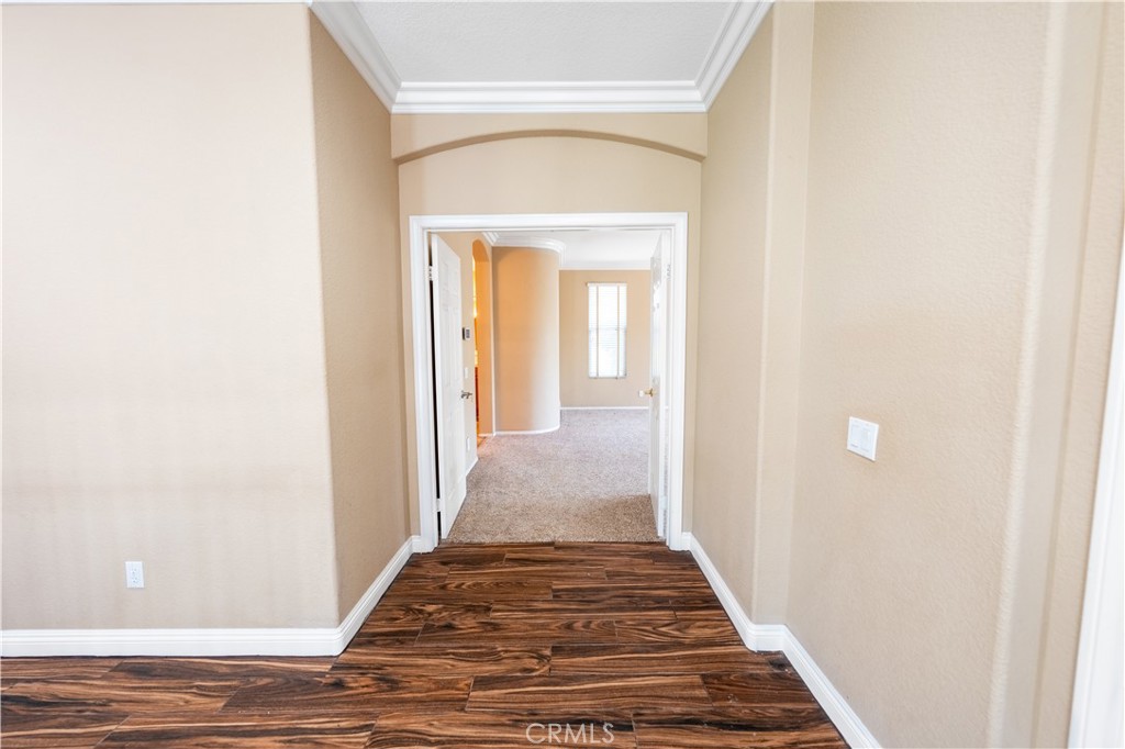 31465 Inverness Court Temecula, CA 92591 - Photo 23 of 71 a view of a hallway with wooden floor and staircase