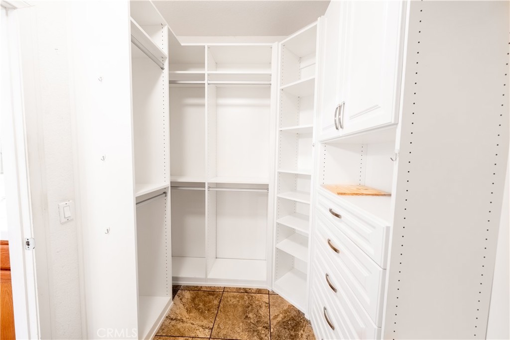 31465 Inverness Court Temecula, CA 92591 - Photo 27 of 71 a view of walk in closet with empty racks