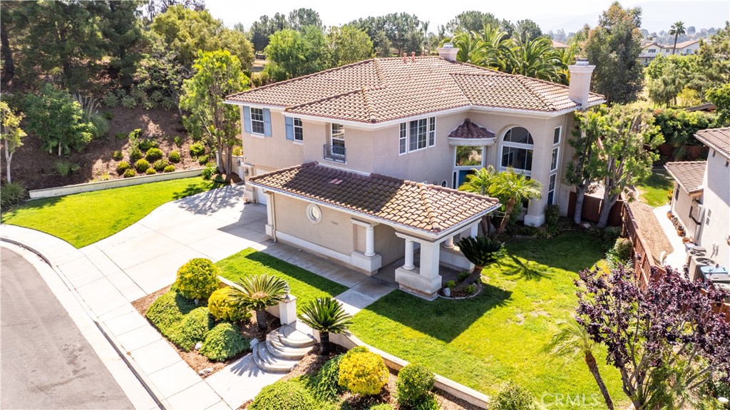 31465 Inverness Court Temecula, CA 92591 - Photo 3 of 71 a aerial view of a house with swimming pool lawn chairs and a yard