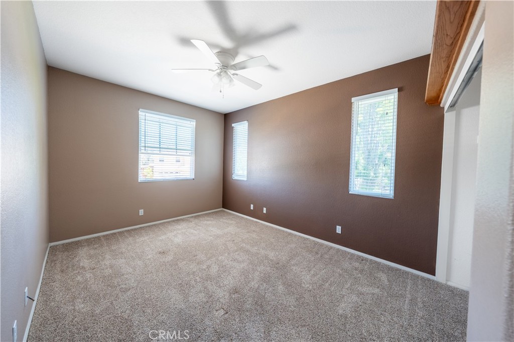 31465 Inverness Court Temecula, CA 92591 - Photo 35 of 71 an empty room with windows and fan