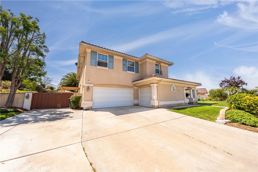 31465 Inverness Court Temecula, CA 92591 - Photo 4 of 71 a front view of a house with a yard and garage