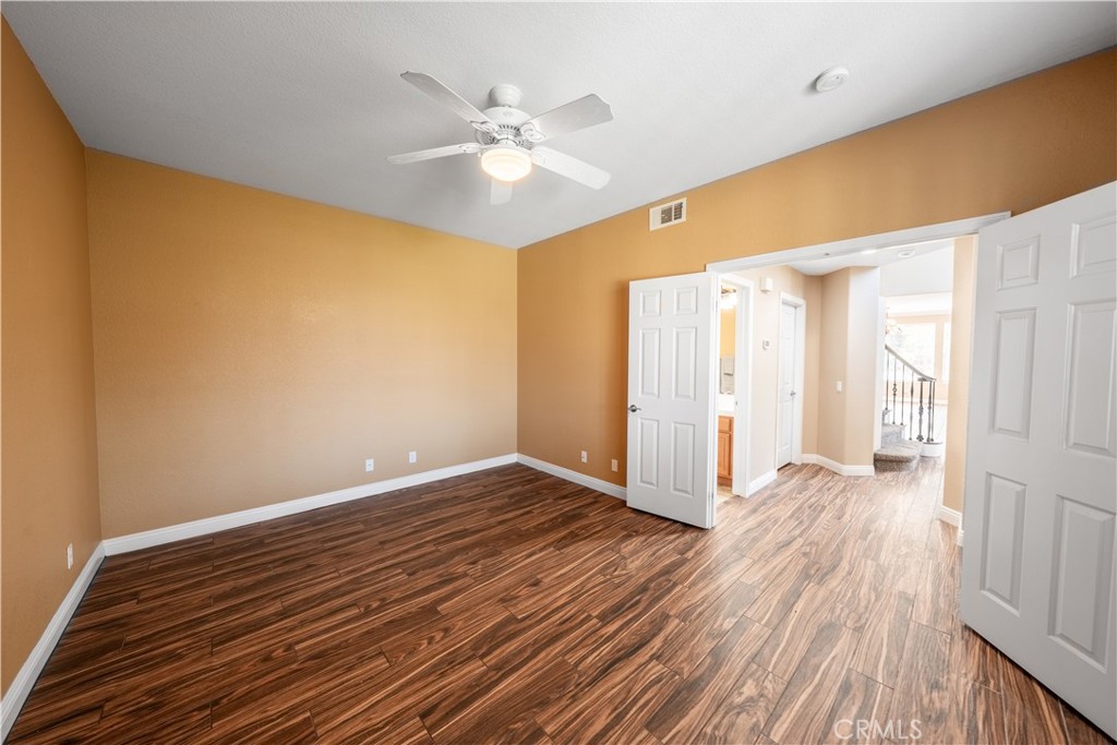 31465 Inverness Court Temecula, CA 92591 - Photo 44 of 71 a view of an empty room with wooden floor